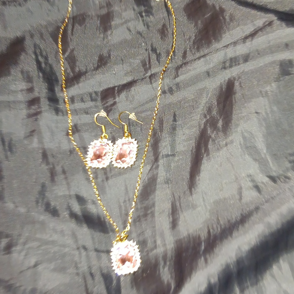 Cubic zirconia/rhinestone and pink faux gem gold plated necklace and earrings.